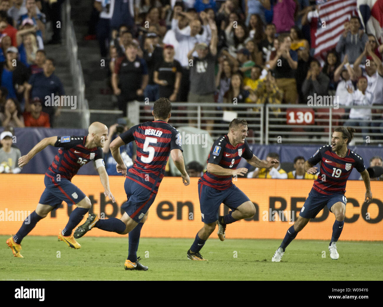USA's Jordan Morris (8) celebrates with Michael Bradley (26), Matt Bressler (8), and Graham Zusi (19) after a goal against Jamaica in the second half of the finals of the CONCACAF Gold Cup at Levi's Stadium in Santa Clara on July 26, 2017. The USA won 2-1.    Photo by Terry Schmitt/UPI Stock Photo