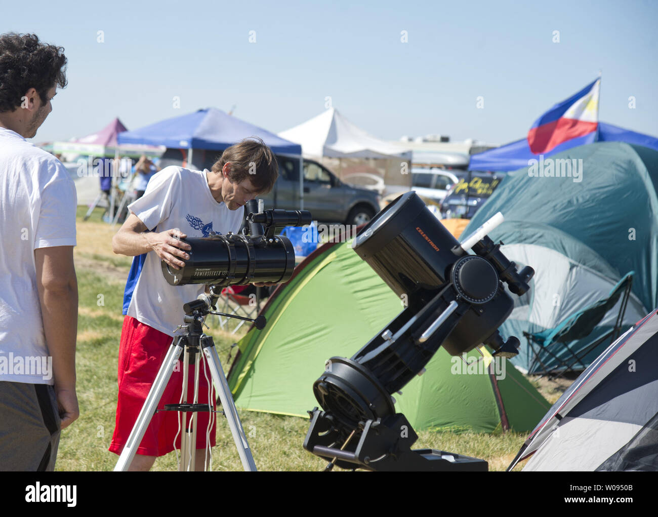 campers adjust telescopes at Solartown in Madras, Oregon on August 19, 2017. In order to accomodate viewers of the August 21 total solar eclipse, and to profit from being in the path of totallity, agricultural sields have been turned into campgrounds.    Photo by Terry Schmitt/UPI Stock Photo
