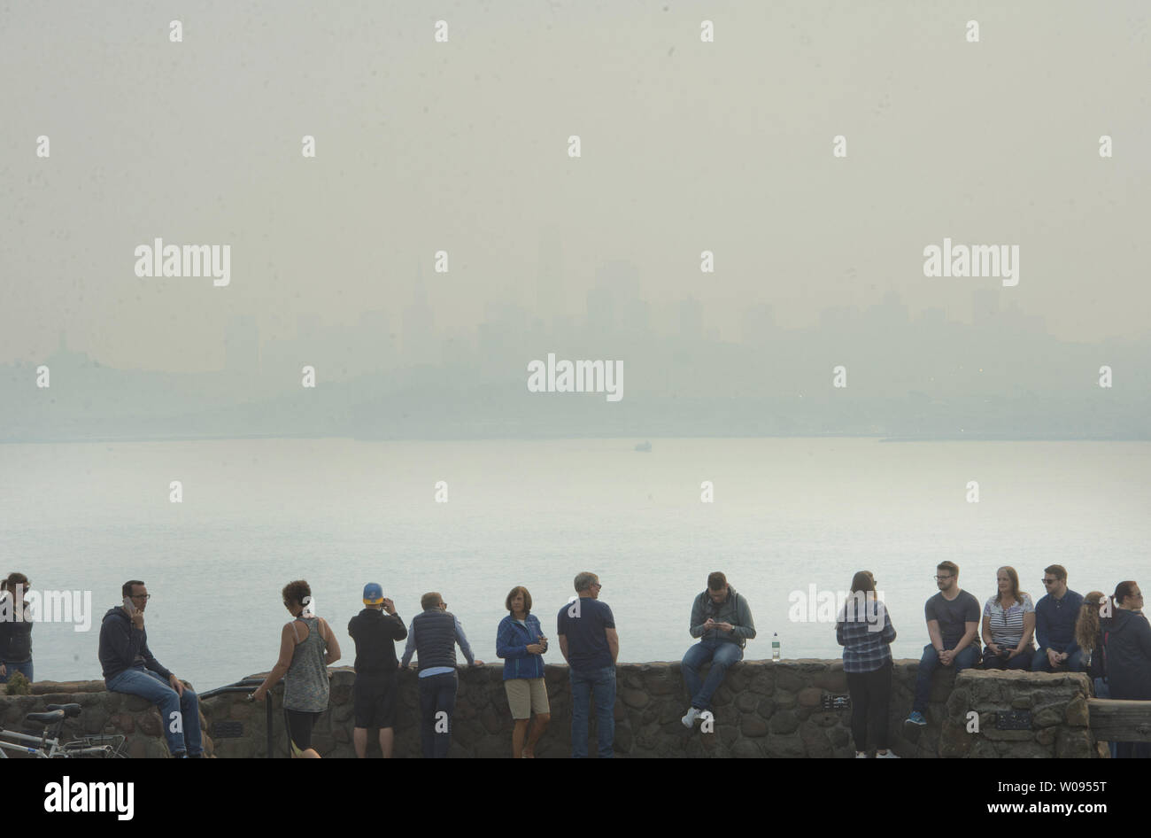San Francisco is barely visible from the as tourists line the scenic
