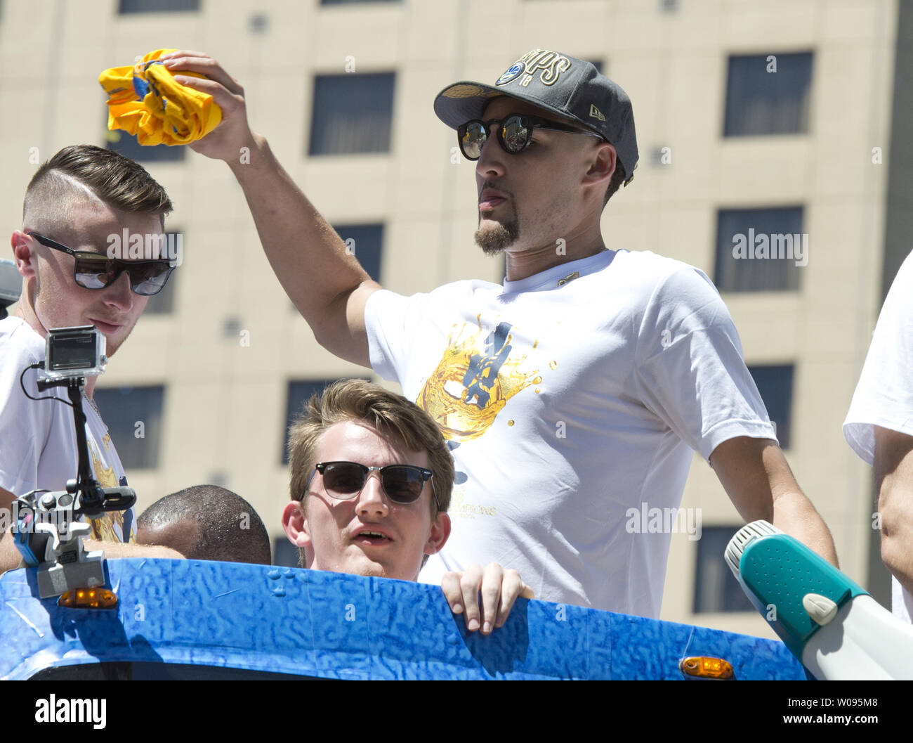 Golden State Warriors Klay Thompson throws a towell to fans during the Warriors victory  parade in Oakland, California on June 12, 2018. The Warriors and their fans are celebrating back to back NBA championships.     Photo by Terry Schmitt/UPI Stock Photo