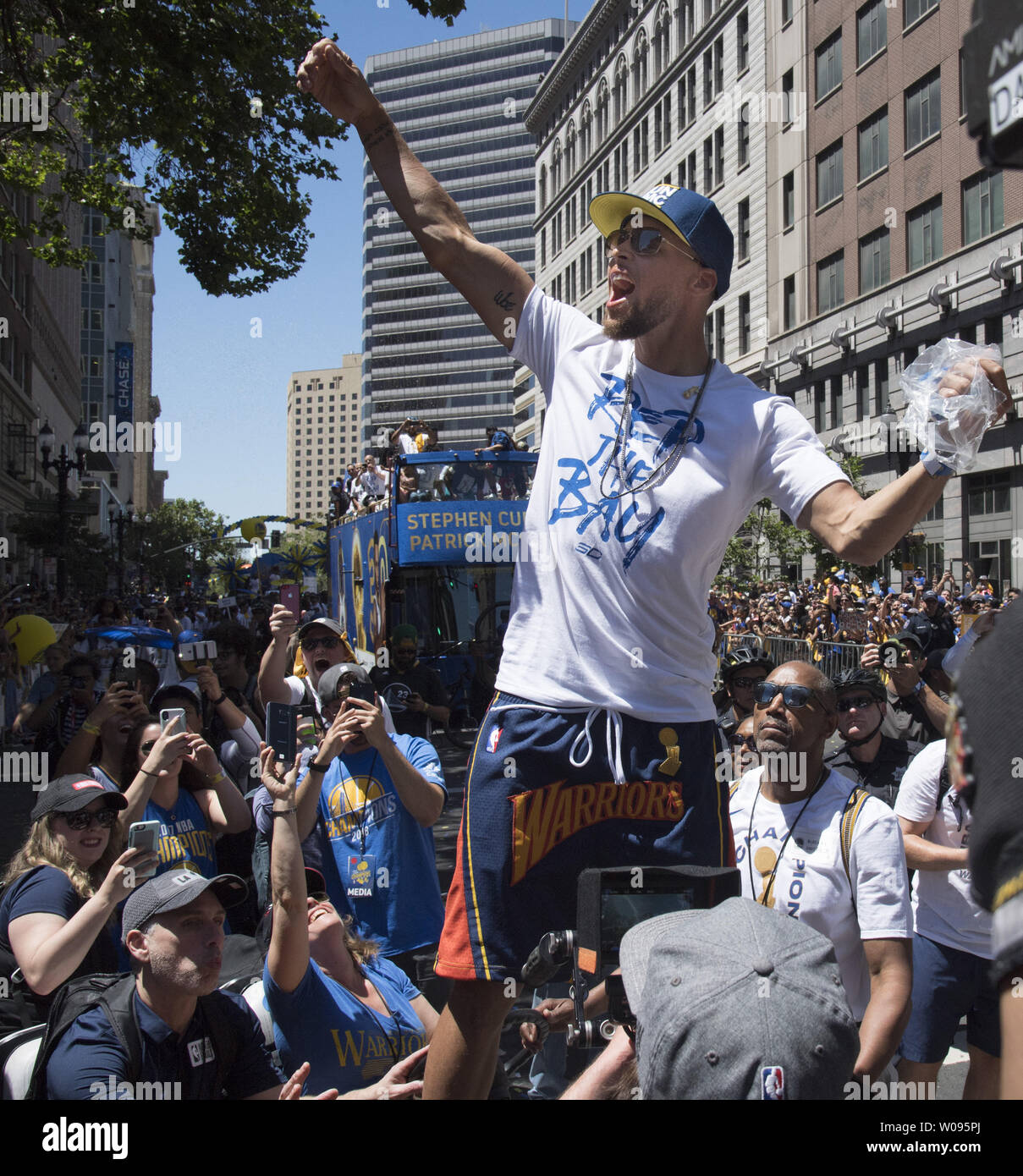 Golden State Warrior Stephen Curry celebrates with fans at the Warriors victory parade in Oakland, California on June 12, 2018