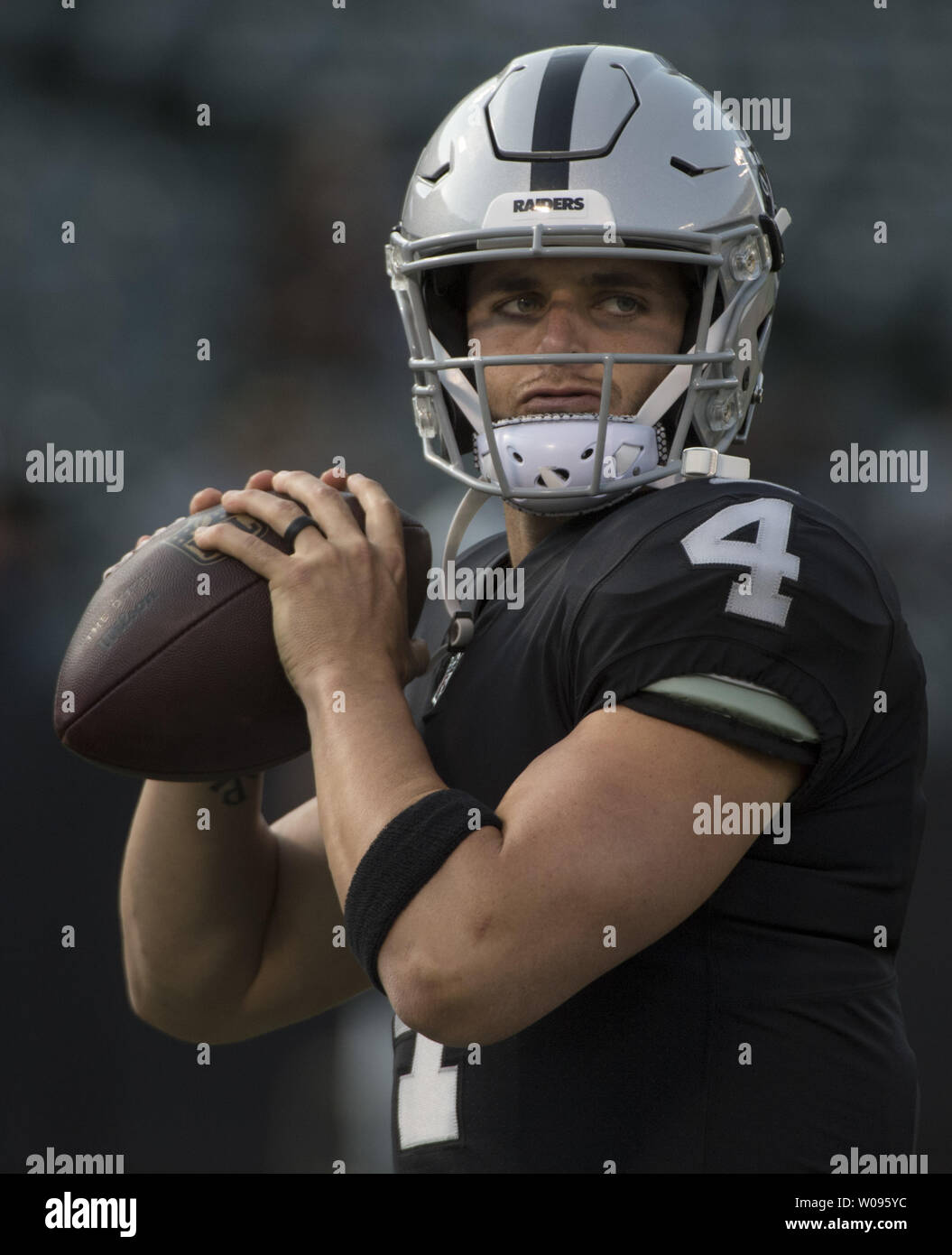 Oakland Raiders QB Derek Carr warms up to play the Detroit Lions at the Coliseum in Oakland, California on August 10, 2018. The Raiders defeated the Lions 16-10.     Photo by Terry Schmitt/UPI Stock Photo