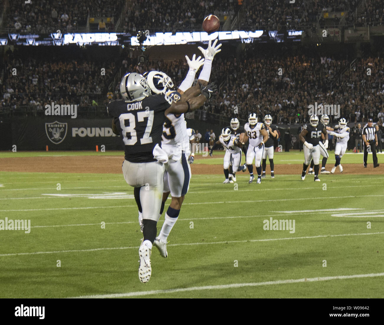 Los Angeles Rams SS John Johnson steps in front of Oakland Raiders Jared Cook (87) to intercept a Derek Carr pass in the end zone in the second quarter at the Coliseum in Oakland, California on Monday, September 10, 2018. The Raiders lost to the Rams 33-13.       Photo by Terry Schmitt/UPI Stock Photo