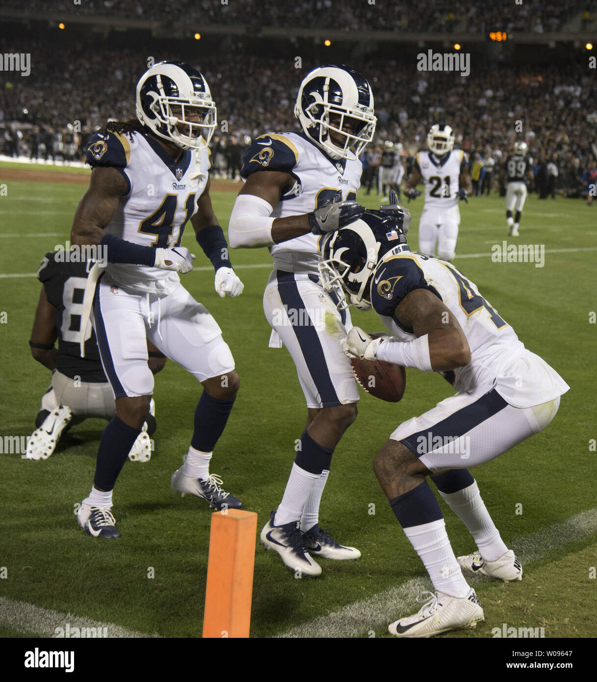 Los Angeles Rams SS John Johnson (R) celebrates intercepting a pass from Oakland Raiders QB Derek Carr with Marqui Christian (41) and Lamarcus Joyner (c) in the second quarter at the Coliseum in Oakland, California on Monday, September 10, 2018. The Rams defeated the Raiders 33-13.       Photo by Terry Schmitt/UPI Stock Photo