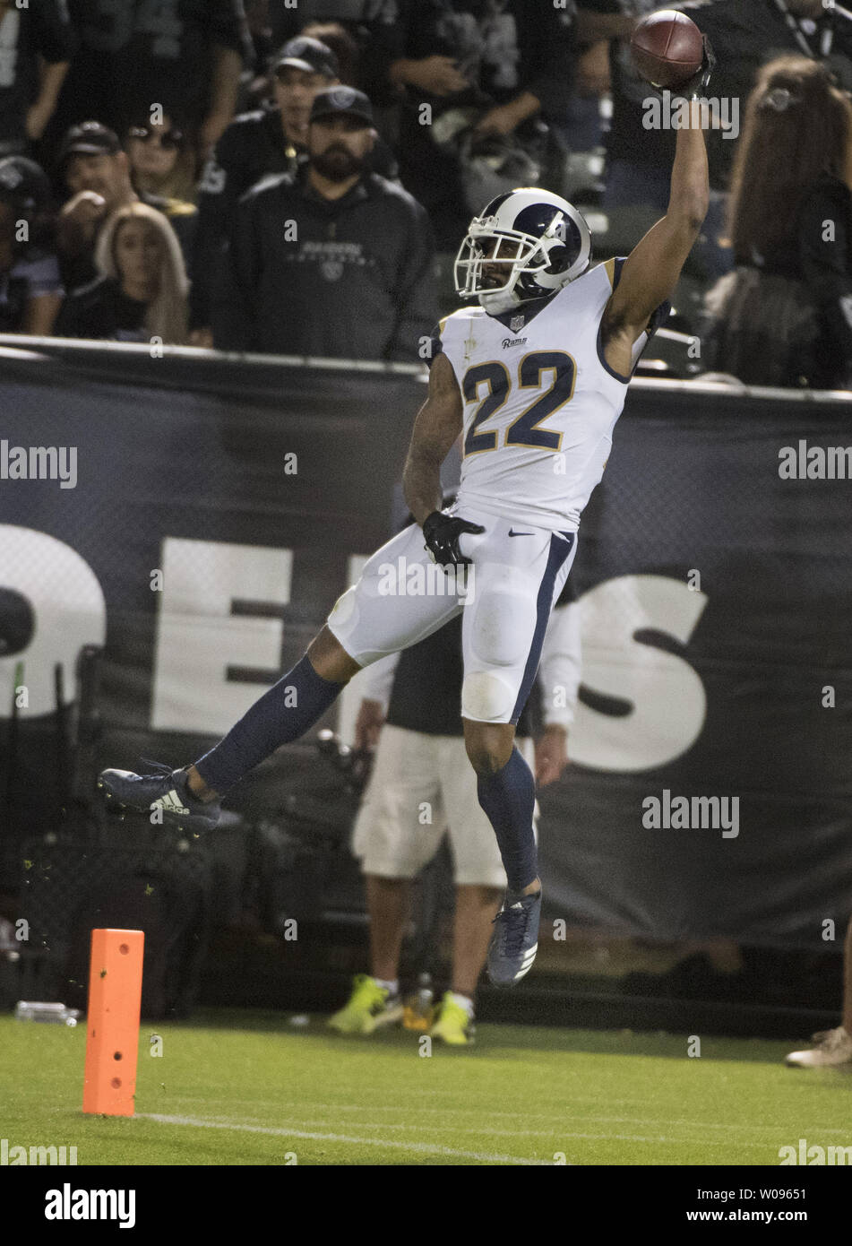 Los Angeles Rams Marcus Peters (22) leaps backwards across the goal line while grabbing his crotch to celebrate a pick 6 against Oakland Raiders QB Derek Carr in the fourth quarter at the Coliseum in Oakland, California on Monday, September 10, 2018. The Rams defeated the Raiders 33-13.       Photo by Terry Schmitt/UPI Stock Photo