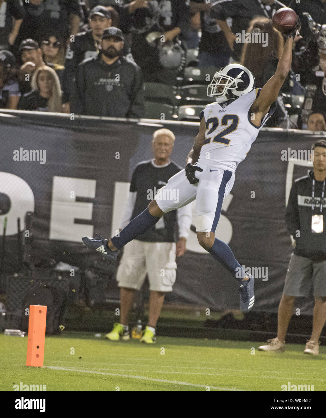 Los Angeles Rams Marcus Peters (22) leaps backwards across the goal line while grabbing his crotch to celebrate a pick 6 against Oakland Raiders QB Derek Carr in the fourth quarter at the Coliseum in Oakland, California on Monday, September 10, 2018. The Rams defeated the Raiders 33-13.       Photo by Terry Schmitt/UPI Stock Photo
