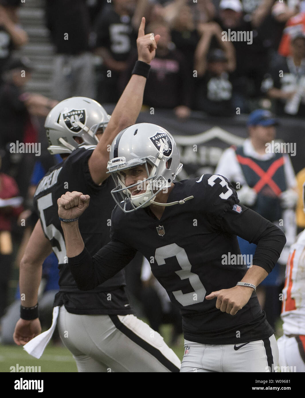 Oakland Raiders kicker Matt McGrane (3) celebrates as holder Johnny Townsend  raises a hand after kicking a 29 yrd field goal to defeat the Cleveland Browns in overtime at the Coliseum in Oakland, California on September 30, 2018. The Raiders won 45-42.     Photo by Terry Schmitt/UPI Stock Photo