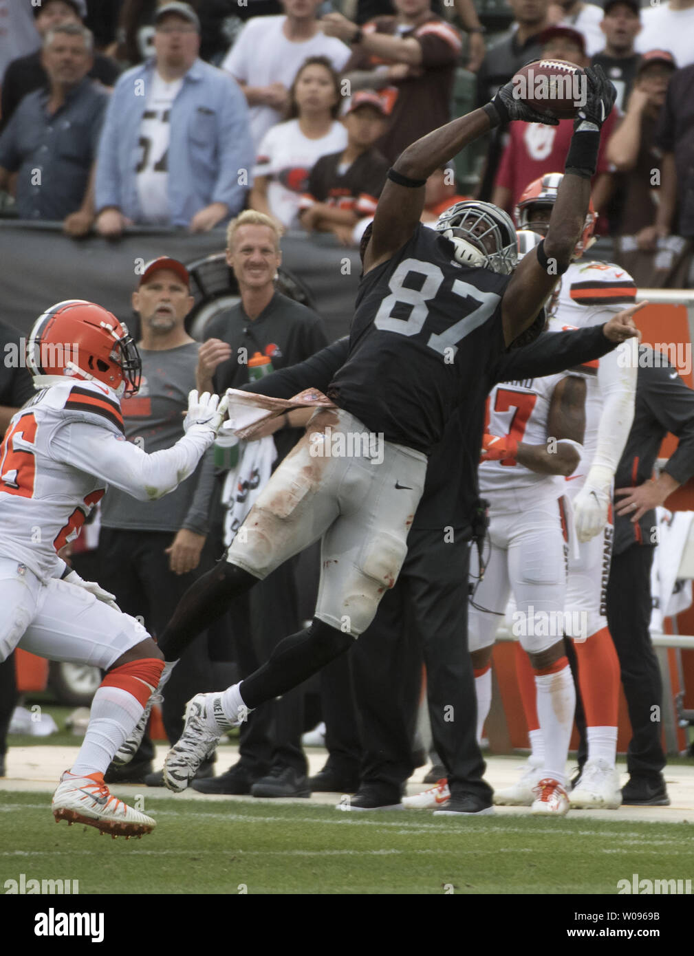 Oakland Raiders TE Jared Cook (87) catches a pass from QB Derek Carr for 24 yards in overtime against the Cleveland Browns at the Coliseum in Oakland, California on September 30, 2018. The Raiders defeated the Browns 45-42.     Photo by Terry Schmitt/UPI Stock Photo