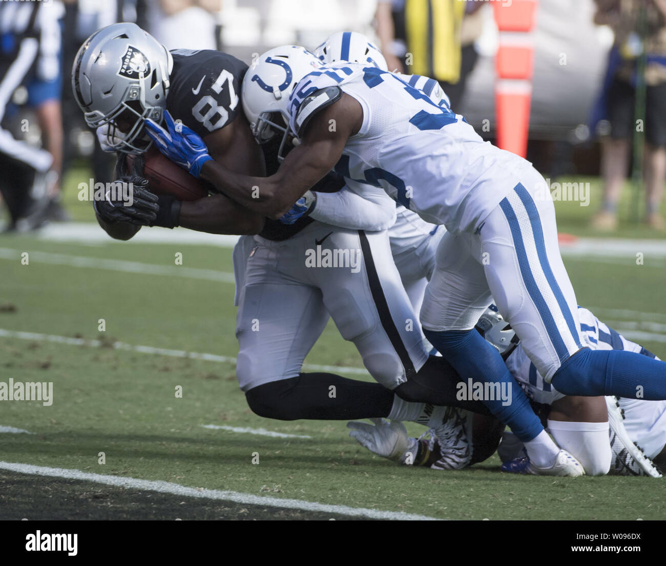Oakland Raiders tight end Jared Cook (87) powers over the goal line for a 25 yard TD pass from QB Derek Carr in the second quarter against the Indianapolis Colts  at the Coliseum Oakland, California on October 28, 2018. The Colts defeated the Raiders 42-28.         Photo by Terry Schmitt/UPI Stock Photo