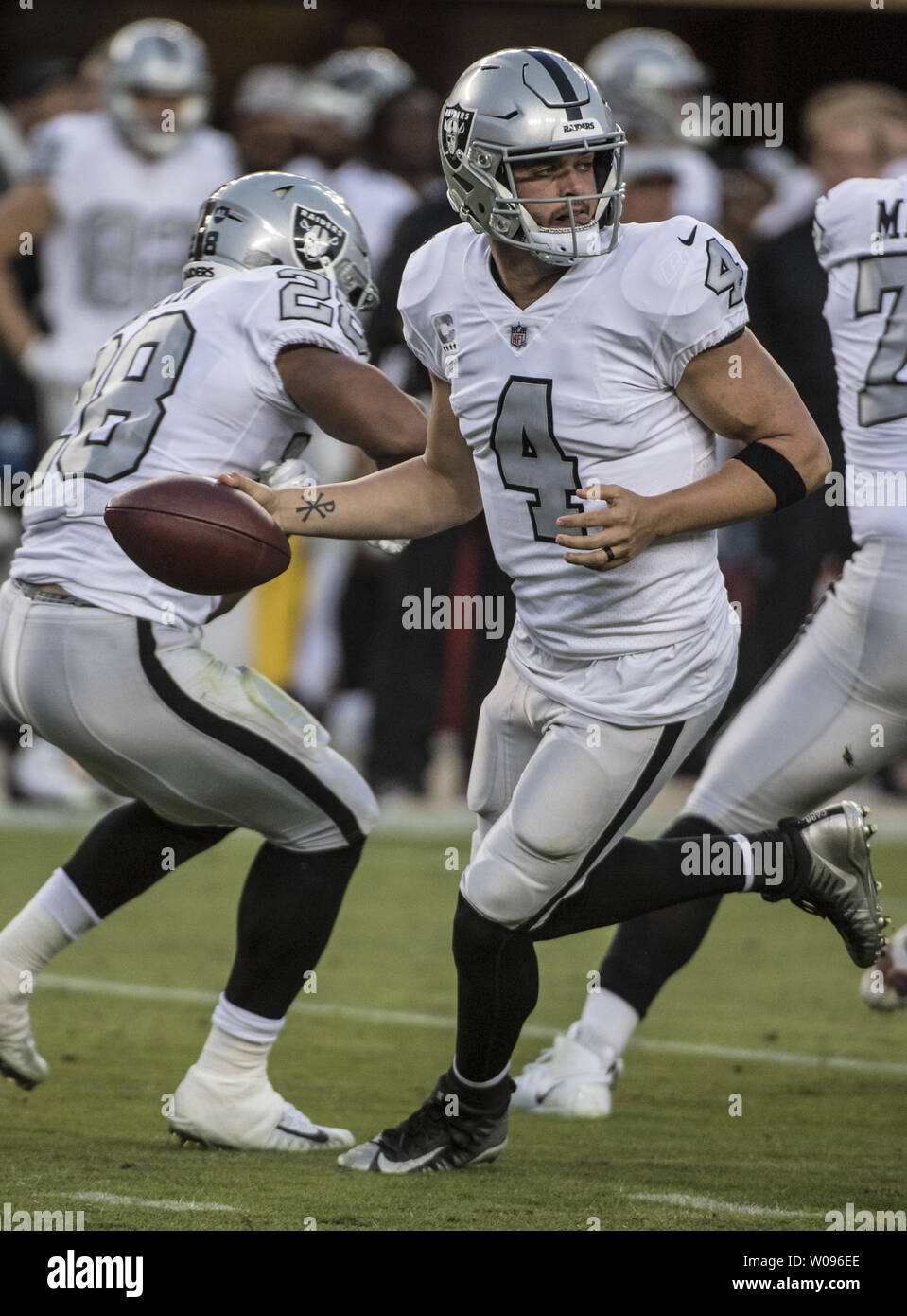 Oakland Raiders quarterback Derek Carr (4) drops back in the first quarter against the San Francisco 49ers in the first quarter at Levi's Stadium in Santa Clara, California on November 1, 2018. The Raiders lost 34-3 to tie the New York Giants at the bottom of the NFL.   Photo by Terry Schmitt/UPI Stock Photo
