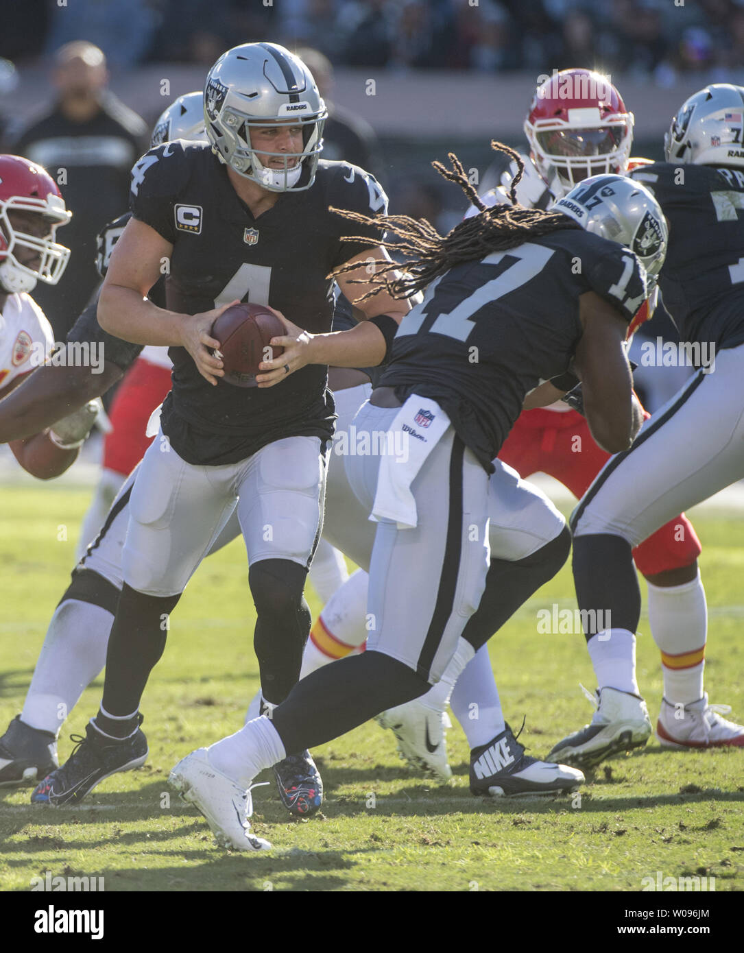 Oakland Raiders QB Derek Carr stands in the pocket against the Kansas City Chiefs in the second quarter at the Coliseum in Oakland, California on December 2, 2018. The Chiefs defeated the Raiders 40-33.    Photo by Terry Schmitt/UPI Stock Photo