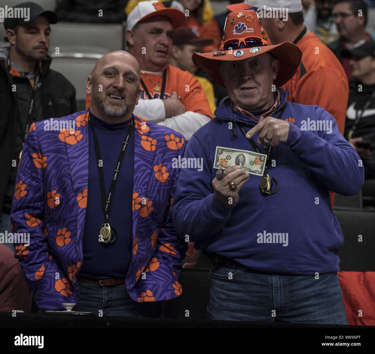 Clemson Tigers fans Andy Price (L) and Dean Cox attend Media Day for the 2019 College Football Playoff National Championship, at the SAP Center in San Jose, California on January 5, 2019. Cox is paying for things in San Jose with two dollar bills stamped with tiger's paws to show their impact on the local economy. Alabama Crimson Tide will play the Clemson Tigers at Levi's Stadium in Santa Clara, California on January 7.    Photo by Terry Schmitt/UPI Stock Photo
