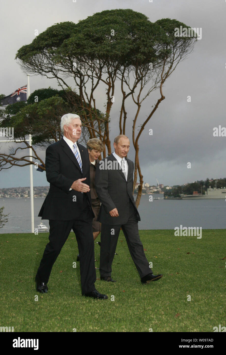 Russian President Vladimir Putin (R) with Australian Governor-General Michael Jeffery (L) and wife Marlena walk during a courtesy call at the Admiralty House in Sydney in Sydney on September 7, 2007. Putin is attending the Asia-Pacific Economic Cooperation (APEC) summit. (UPI Photo/Anatoli Zhdanov) Stock Photo