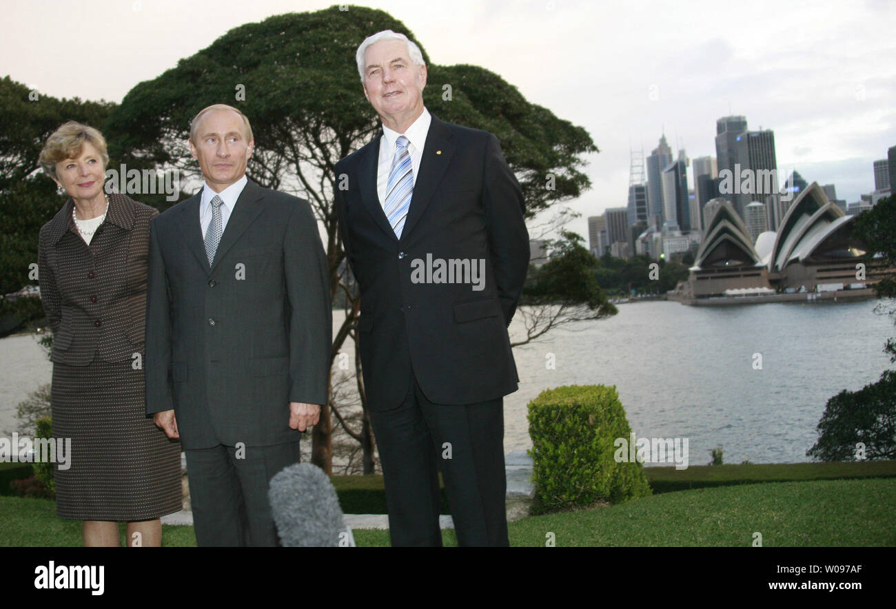 Russian President Vladimir Putin (C) with Australian Governor-General Michael Jeffery (R) and wife Marlena talk to reporters during a courtesy call at the Admiralty House in Sydney in Sydney on September 7, 2007. Putin is attending the Asia-Pacific Economic Cooperation (APEC) summit. (UPI Photo/Anatoli Zhdanov) Stock Photo