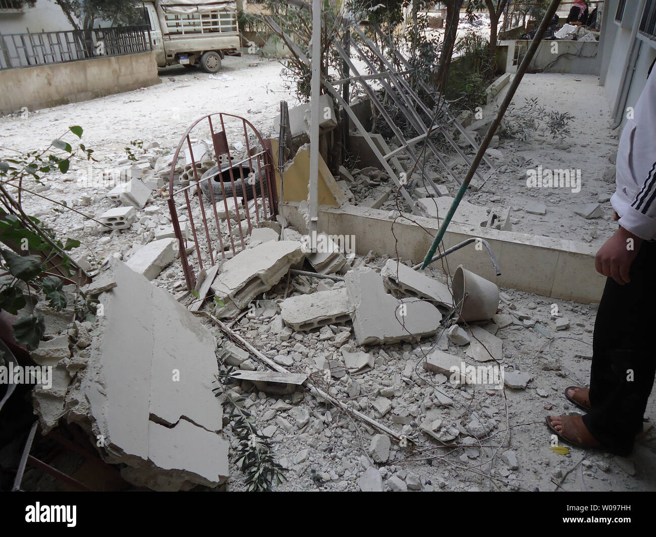 Debris liters the front of a house allegedly damaged after shelling by government forces, in Baba Amr neighborhood of Homs on February 9, 2012. Tanks amassed outside opposition neighborhoods in Homs as Alawite-led forces bombarded the Syrian city for the sixth day and residents expected a major push to subdue the center of revolt against President Bashar al-Assad's rule.    UPI Stock Photo