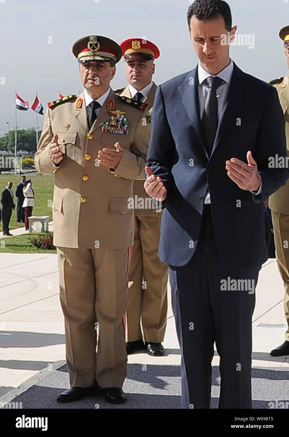 A picture dated May 6, 2011 and released by the Syrian Arab News Agency (SANA) shows Syrian President Bashar al-Assad (R) and Minister of Defense, Lieutenant General Daoud Rajha (L), attending a ceremony at the tomb of the unknown soldier in Damascus. Syrian President Bashar al-Assad appointed Freij as the new defence minister on July 18, 2012, after Rajha was killed the same day in a suiicde bomb blast that killed two top regime officials. UPI Stock Photo