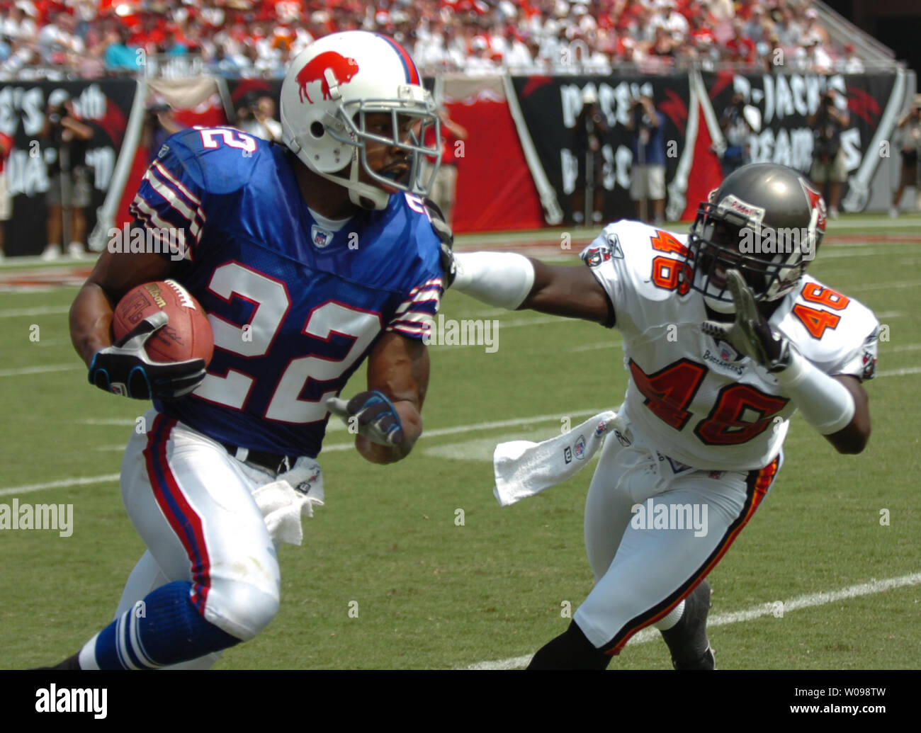 Buffalo Bills' Nate Clements (22) breaks a tackle by Tampa Bay Buccaneers' Blue Adams (46) during first-quarter action at Raymond James Stadium Sept. 18, 2005 in Tampa, Fl. The Buccaneers beat the Bills 19-3 and are now 2-0.  (UPI Photo/Cathy Kapulka) Stock Photo