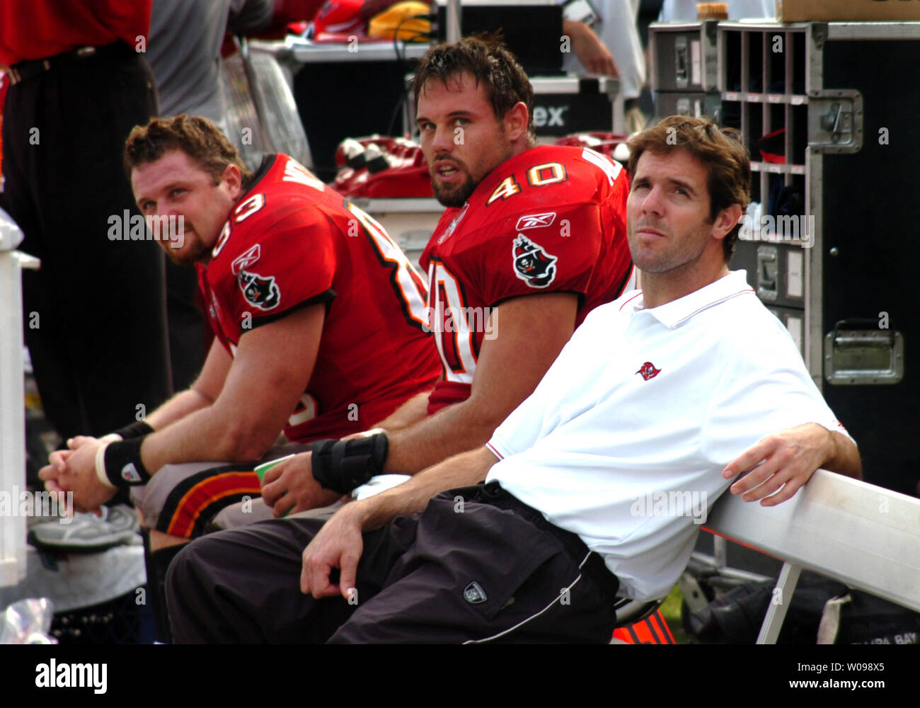 Tampa Bay Buccaneers' tight end Dave Moore (83) fullback Mike Alstott (40)  and injured quarterback Brian Griese watch a replay after Alstott scored a  touchdown during the fourth quarter in a game