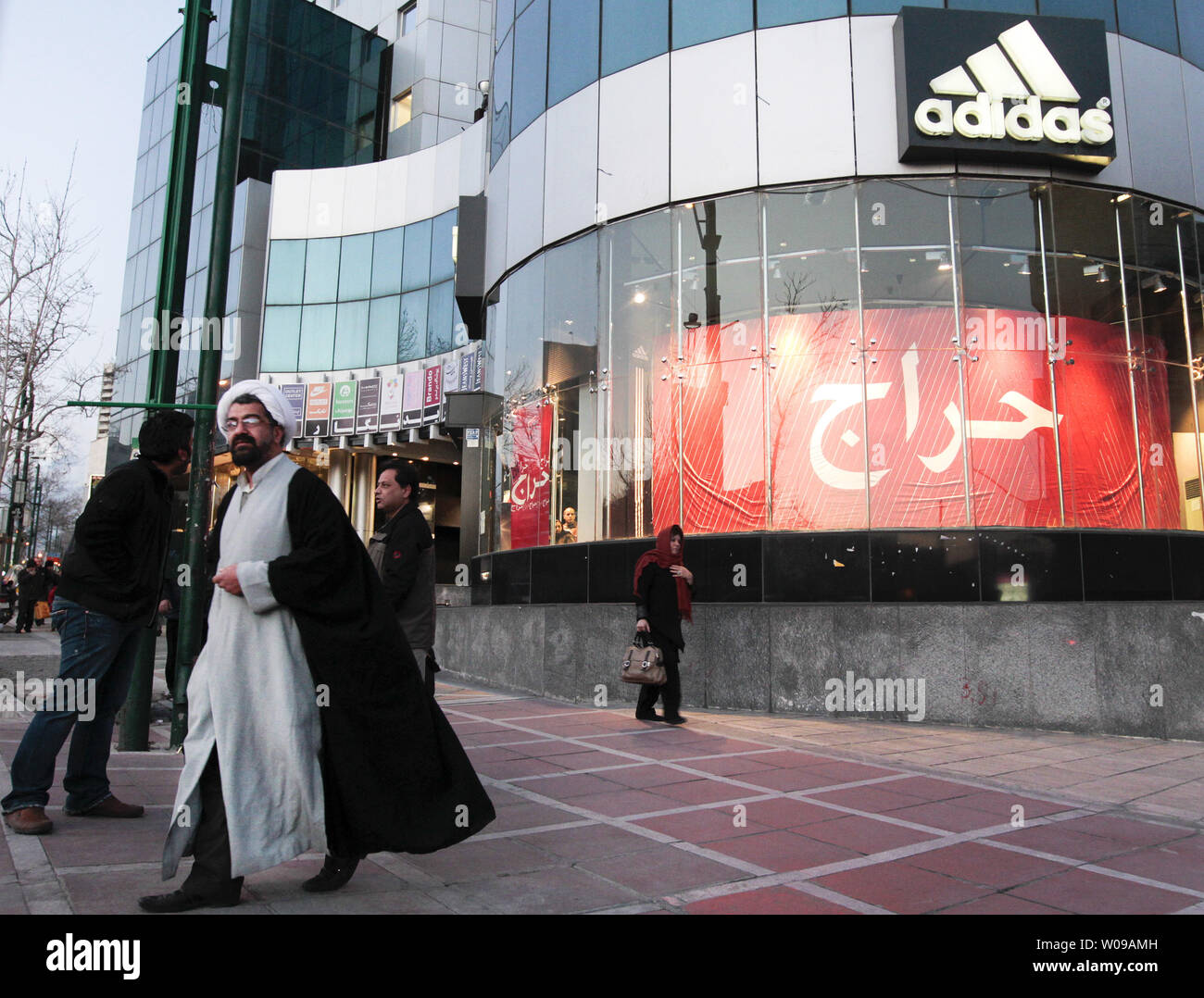 Kreek Kleuterschool Ringlet An Iranian clergyman walks next to the Adidas store in Tehran, Iran on  February 26, 2012. Campaigning for Iran's parliamentary election officially  started on February 23, 2012 and closes on March 1,
