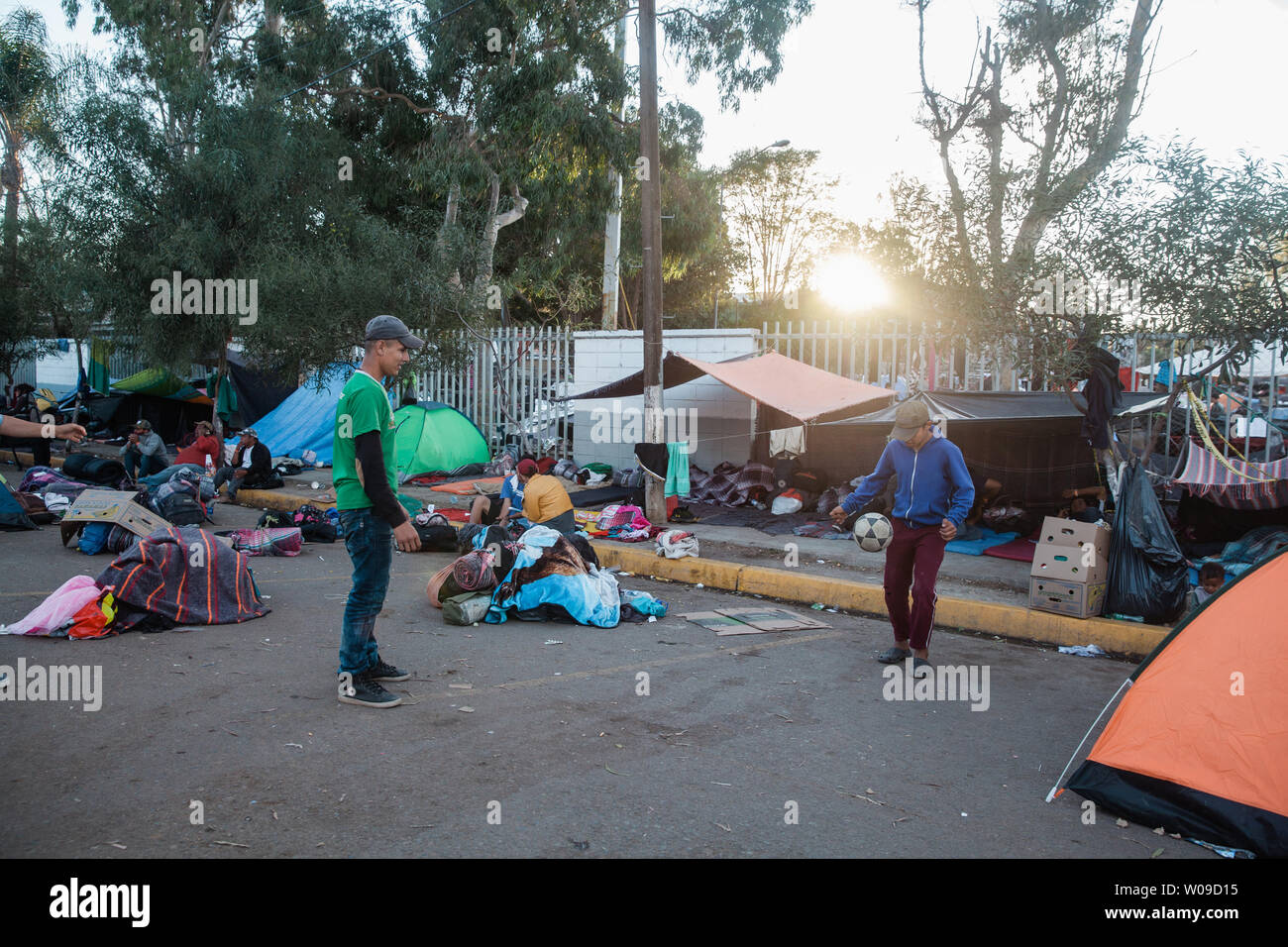 People play soccer to occupy the time in front of the makeshift migrant shelter at the Unidad Deportiva Benito Juarez in Tijuana, Mexico on November 26, 2018.    Photo by Ariana Drehsler/UPI Stock Photo