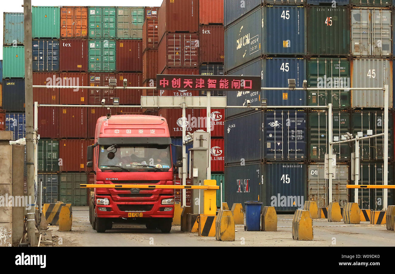 Chinese drivers transport shipping containers from the port city of ...