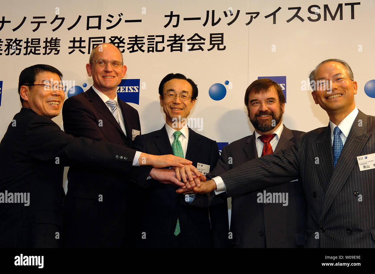 Dirk Stenkamp, head of Carl Zeiss NTS clasps hands during a press  conference in Tokyo, Japan, on Mar. 16, 2006. He is in Japan to announce  his company's global collaboration with Seiko