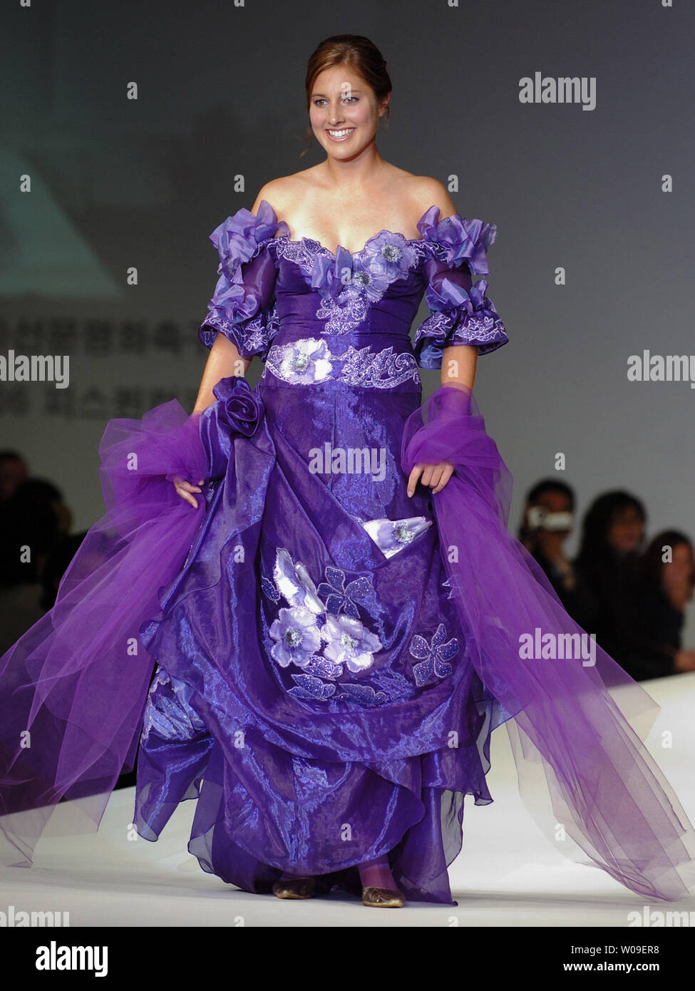 Randee Hermus, a defender on Canada's women's national team, walks down the catwalk wearing a creation by Andre Kim during a fashion show as part of the opening ceremony of the 2006 Peace Queen Cup (soccer) in Seoul, South Korea on October 27 2006.    (UPI Photo/Keizo Mori) Stock Photo