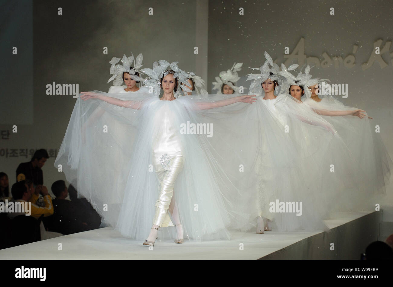 Models walk down the catwalk wearing creations by Andre Kim during a fashion show as part of the opening ceremony of the 2006 Peace Queen Cup (soccer) in Seoul, South Korea on October 27 2006.    (UPI Photo/Keizo Mori) Stock Photo