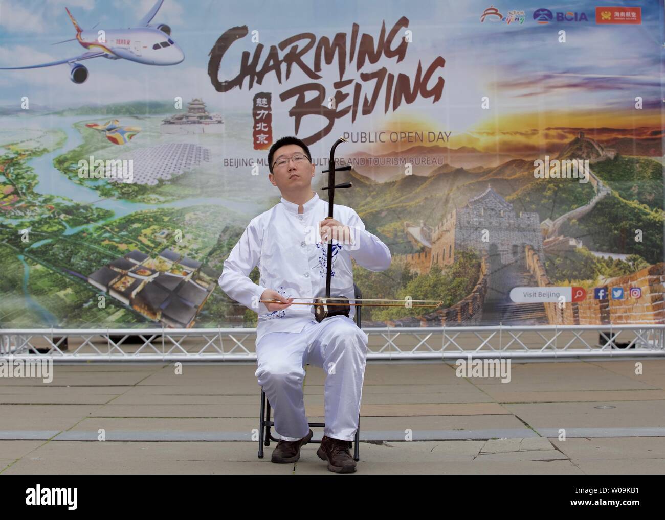 Edinburgh, UK, 25th Jun, 2019: At a Beijing tourism promotion a musician plays a Erhu, a two-stringed instrument known in the west as a Chinese violin Stock Photo