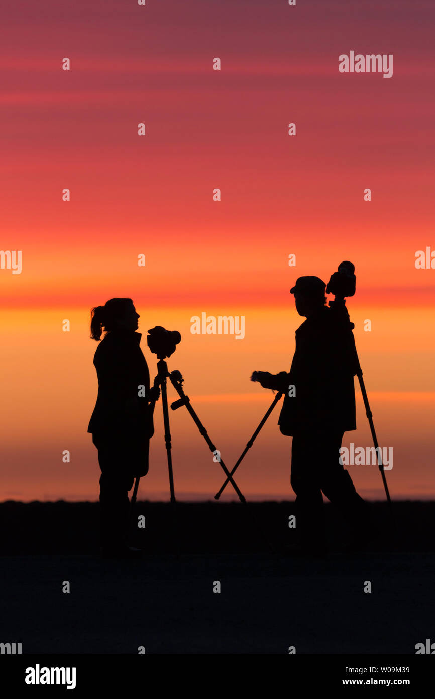 Couple photographing on sunset hi-res stock photography and images - Alamy