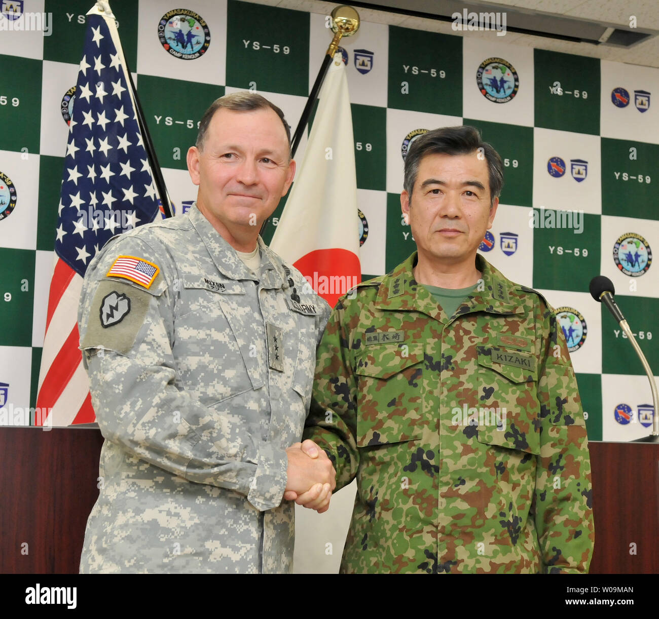 U.S. Army Pacific, Commander, Lt. Gen. Benjamin Mixon shakes hands with ...