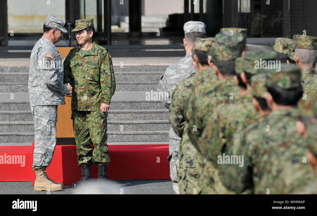 U.S. Army Pacific, Commander, Lt. Gen. Benjamin Mixon(L) shakes hands ...