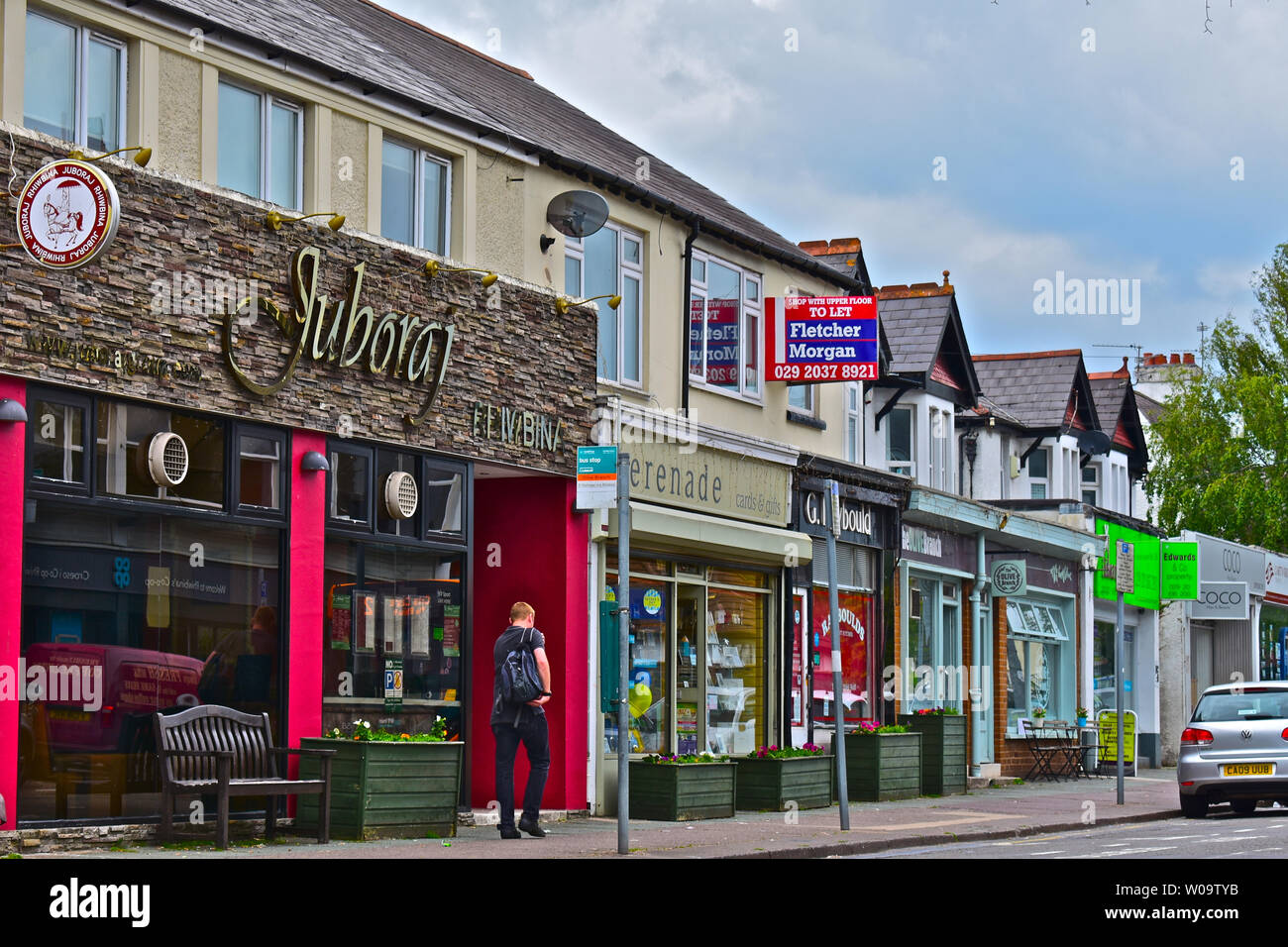 traditional row of shops with flats/ offices above, in the centre of