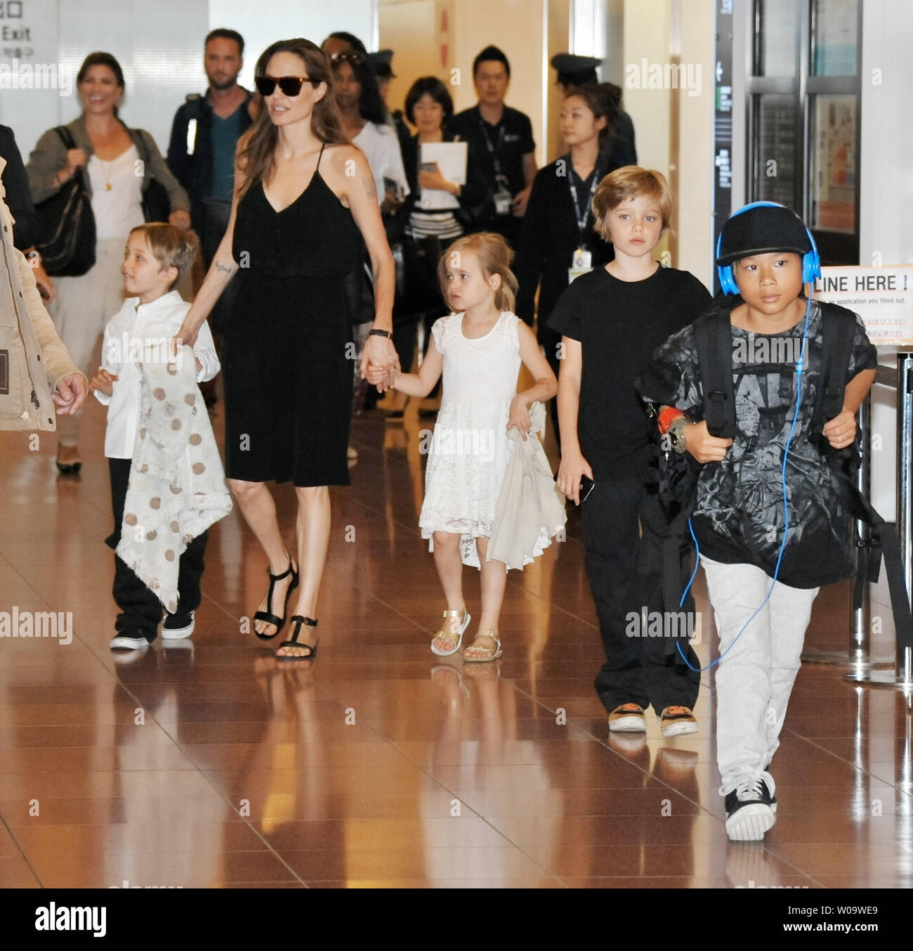 (L-R) Knox Leon Jolie-Pitt, Angelina Jolie, Vivienne Jolie-Pitt, Shiloh Jolie Pitt and Pax Thien Jolie-Pitt  arrive at Tokyo International Airport in Tokyo, Japan on June 21, 2014. Jolie and family are in Tokyo for the Japanese premiere of Maleficent.       UPI/Keizo Mori Stock Photo