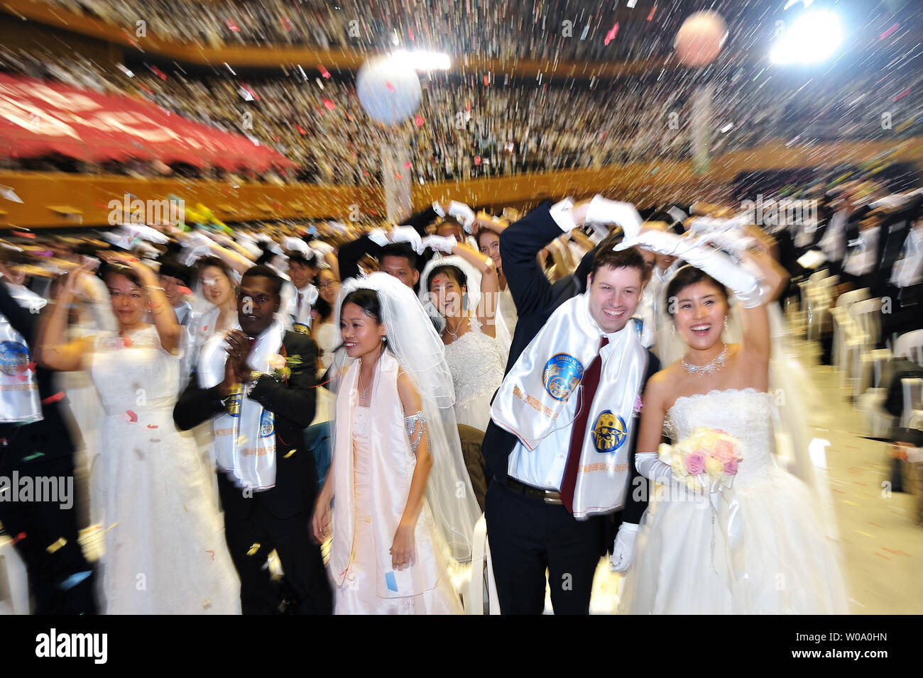 Newly married couples celebrate during a Blessing Ceremony of the Family Federation for World Peace and Unification at the CheongShim Peace World Center in Gapyeong, South Korea, on February 20, 2016.     Photo by Keizo Mori/UPI Stock Photo