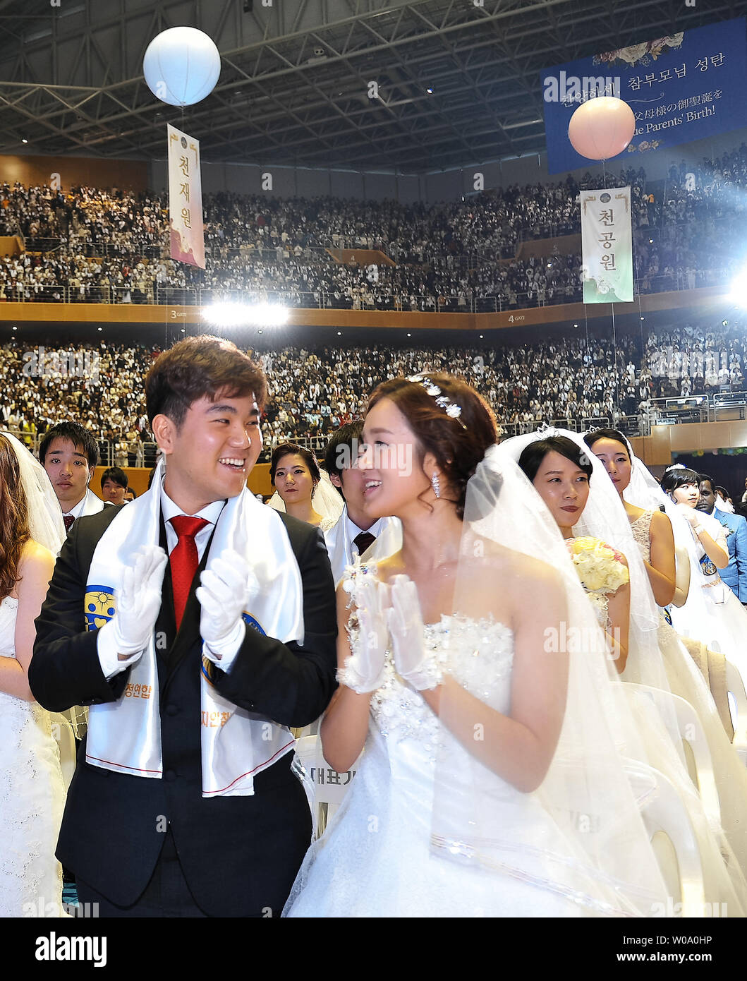 Newly married couples celebrate during a Blessing Ceremony of the Family Federation for World Peace and Unification at the CheongShim Peace World Center in Gapyeong, South Korea, on February 20, 2016.     Photo by Keizo Mori/UPI Stock Photo