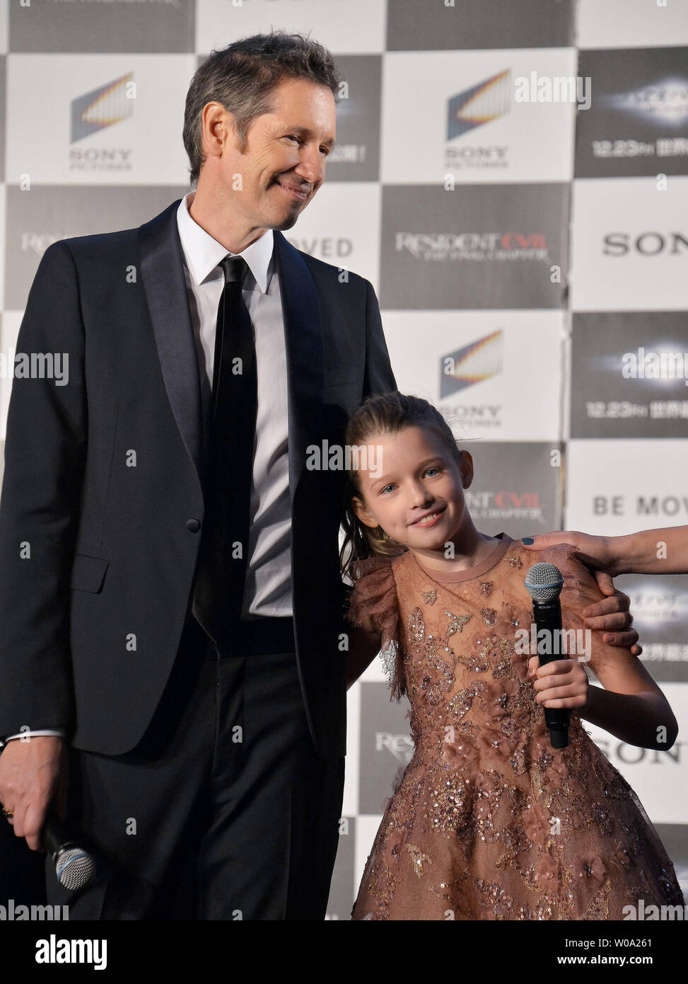 Director Paul W.S. Anderson(R) and his daughter Ever Anderson attend the  world premiere for the film Resident Evil: The Final Chapter in Tokyo,  Japan on December 13, 2016. Photo by Keizo Mori/UPI