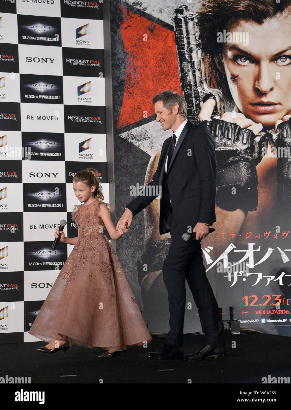 Director Paul W.S. Anderson(R) and his daughter Ever Anderson attend the  world premiere for the film Resident Evil: The Final Chapter in Tokyo,  Japan on December 13, 2016. Photo by Keizo Mori/UPI