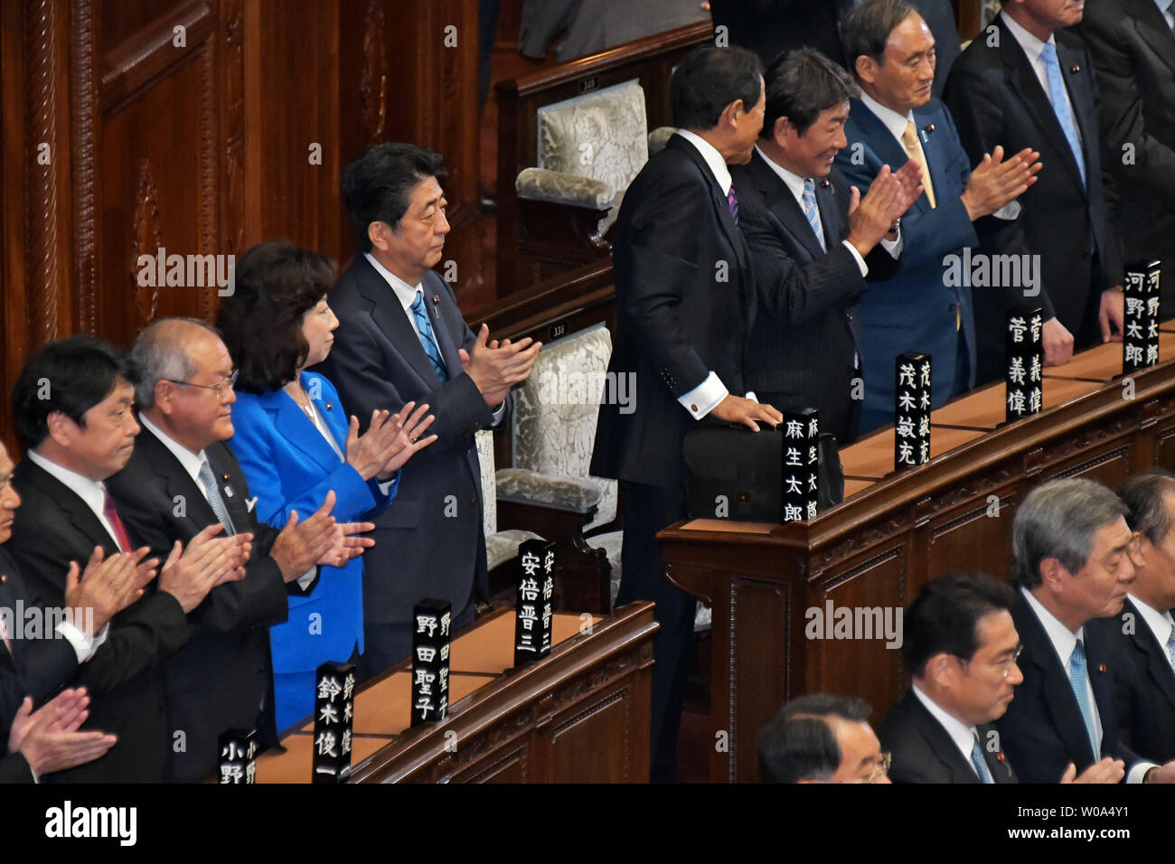 Japan's Prime Minister Shinzo Abe clap his hands with his cabinet members at the plenary Diet session of the House of Representatives in Tokyo, Japan on September 28, 2017.     Photo by Keizo Mori/UPI Stock Photo