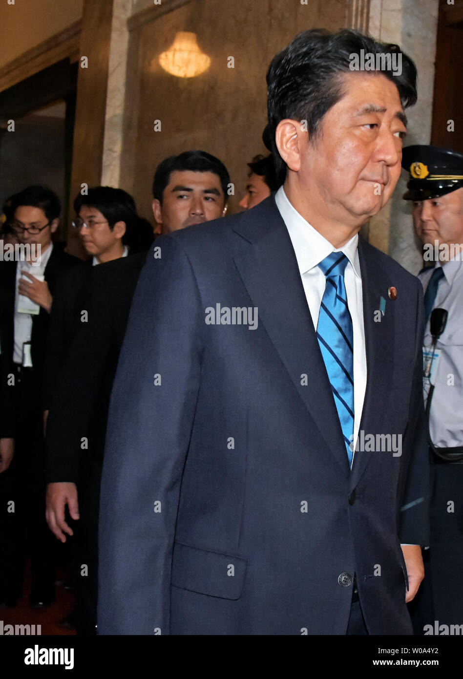 Japan's Prime Minister Shinzo Abe walks after the plenary Diet session of the House of Representatives in Tokyo, Japan on September 28, 2017.     Photo by Keizo Mori/UPI Stock Photo