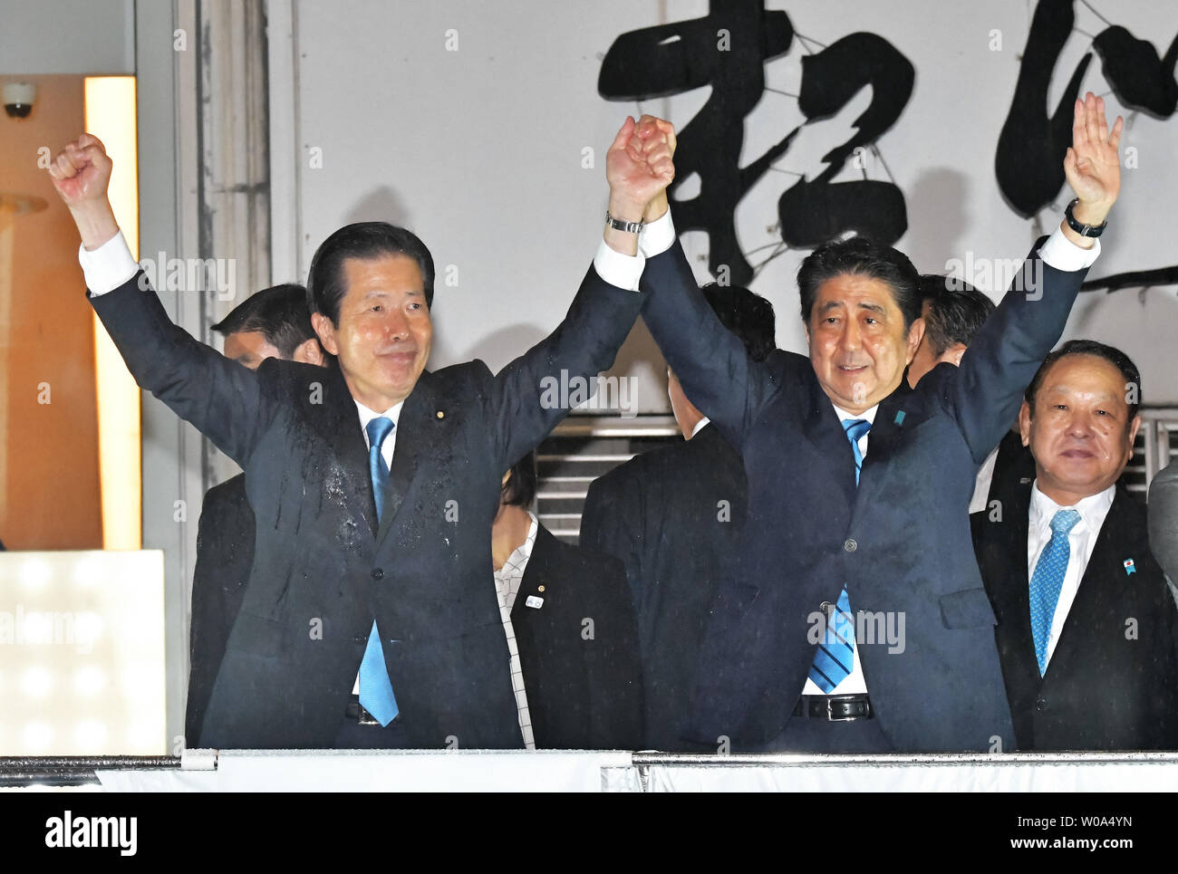 Japan's Prime Minister Shinzo Abe raises his fists with coalition Komeito Party leader Natsuo Yamaguchi (L) during the stump speech at Shibuya district in Tokyo, Japan on September 28, 2017.     Photo by Keizo Mori/UPI Stock Photo