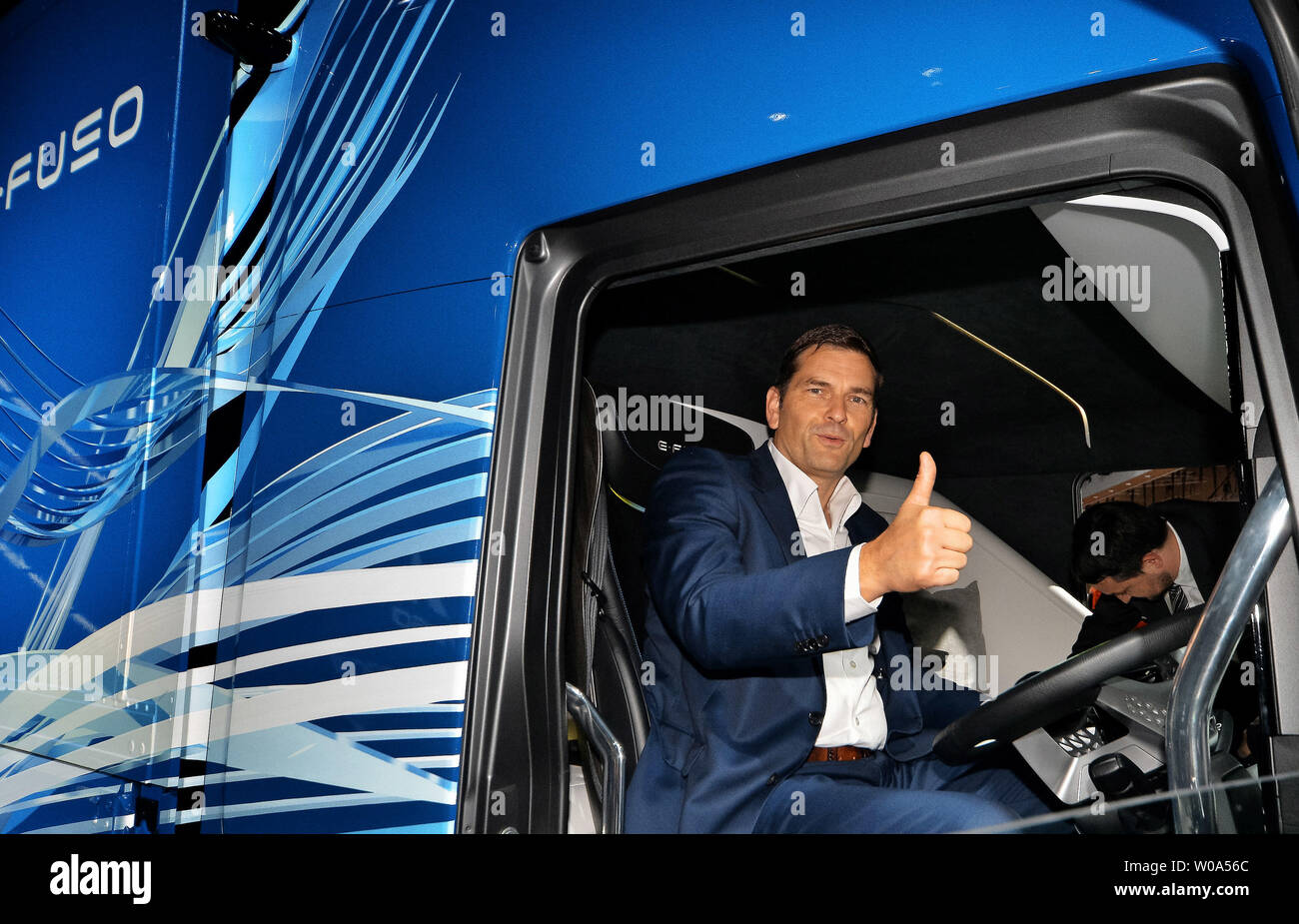 Mitsubishi Fuso Truck and Bus Corporation President and CEO, Marc Llistosella poses with concept model 'E-Fuso Vision One' during press preview at 45th Tokyo Motor Show 2017 in Tokyo, Japan, on October 25, 2017.      Photo by Keizo Mori/UPI Stock Photo