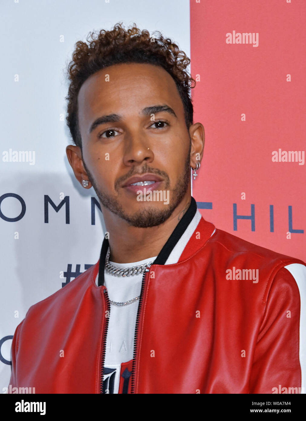 Racing driver Lewis Hamilton attend the event 