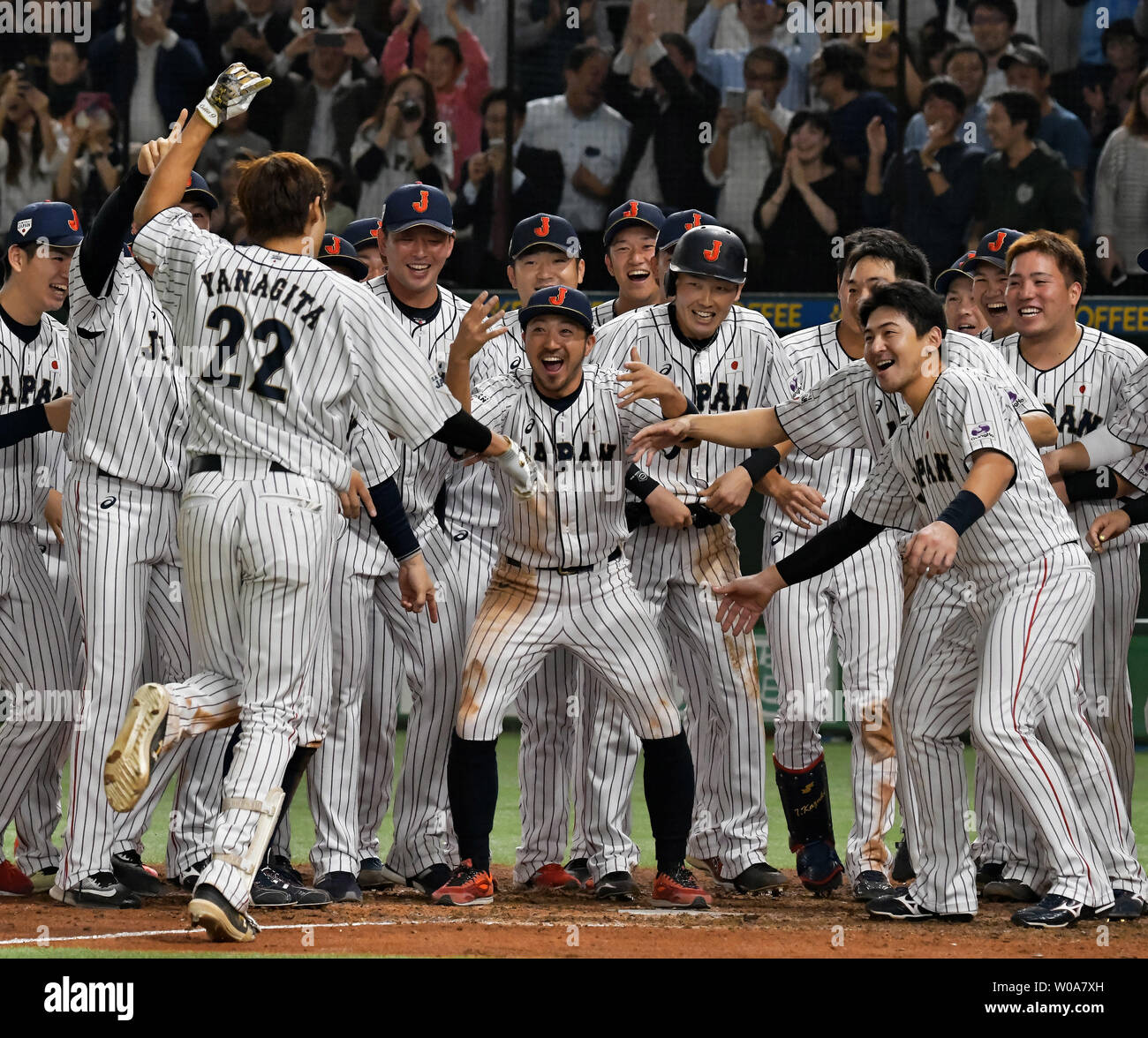 Yanagita Yuki (22), center fielder of the Japan's national team celebrates  with his teammates after his walk off home run in an exhibition game  matching Japan's national team and MLB all stars