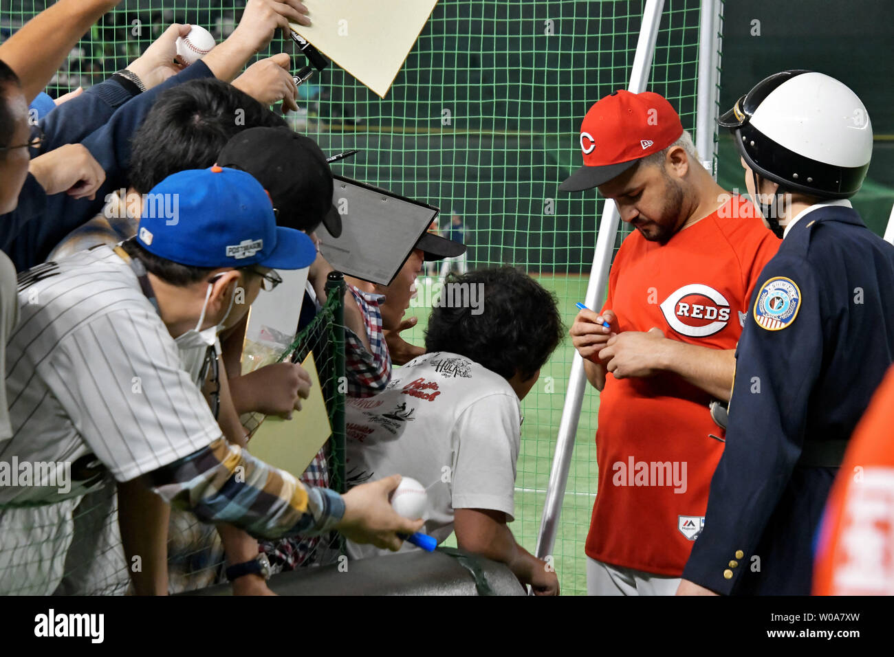 Eugenio Suarez, shortstop of the Cincinnati Reds, signs autographs for  Japanese fans before an exhibition game pitting Japan's national team and  MLB all stars of Japan All-Star Series 2018 at Tokyo Dome