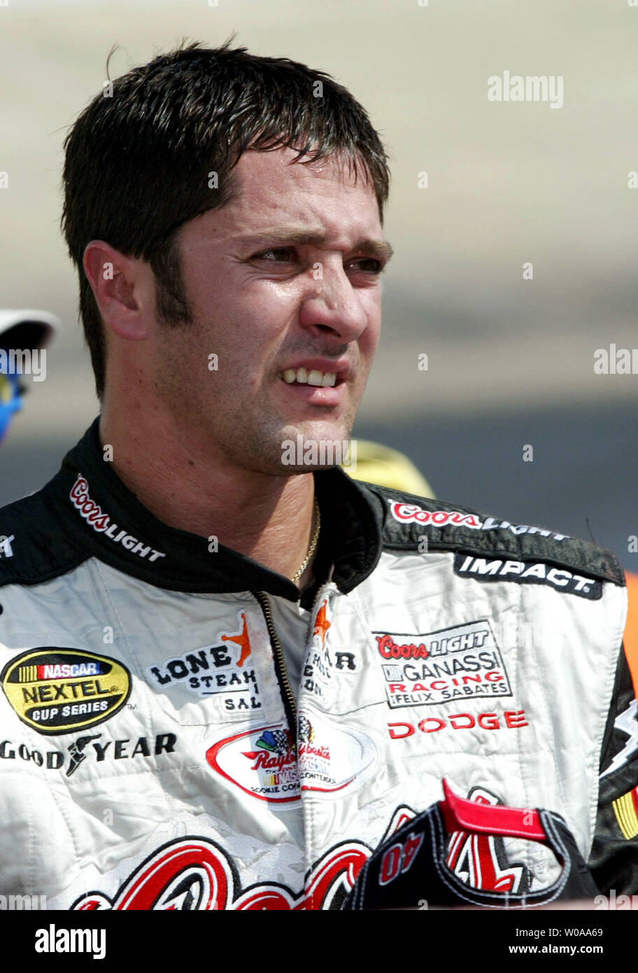 NASCAR race car driver David Stremme stands in his pit box after