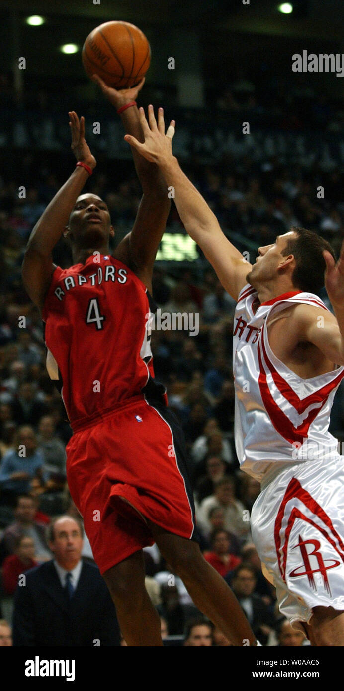 Toronto Raptors Chris Bosh Makes A Jump Shot As Houston Rockets Scott Padgett Tries To Block In Third Quarter Action At The Air Canada Center In Toronto Canada On Nov 16 03 Toronto Raptors Chris Bosh Makes A Jump Shot As Houston Rockets Scott Padgett Tries To Block In Third Quarter Action At The Air Canada Center In Toronto Canada On Nov 16 03