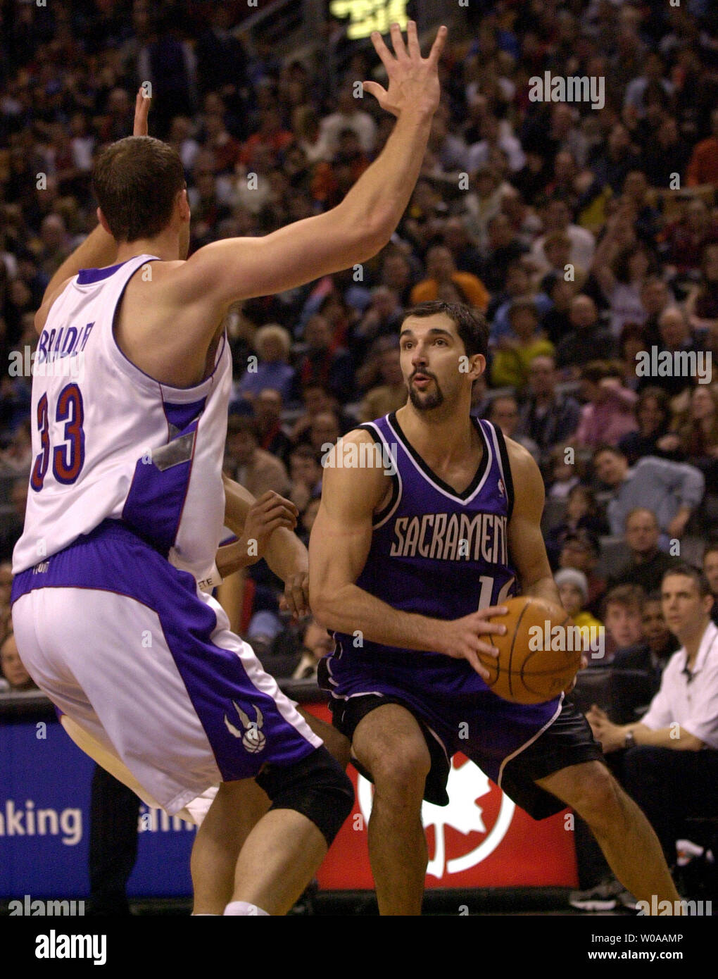 Sacramento Kings' Predrag Stojakovic looks to make a shot as Toronto  Raptors' Michael Bradley guards him in first quarter action at the Air  Canada Center in Toronto, Canada on Feb. 22, 2004.