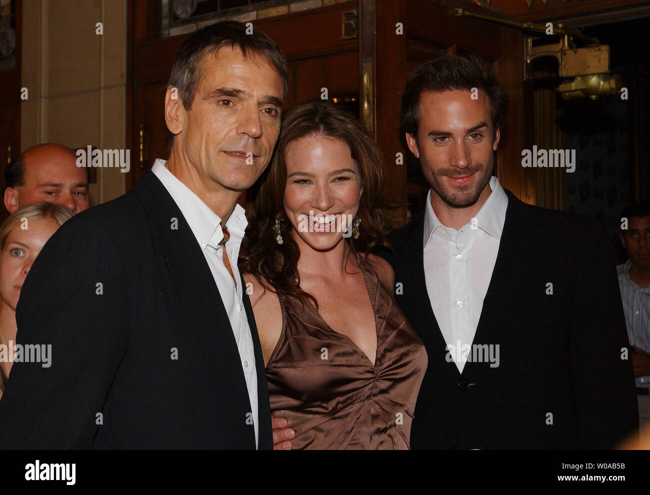 Jeremy Irons (left), Lynn Collins and Joseph Fiennes pose for photographers on the red carpet before the Toronto International Film Festival screening of 'The Merchant of Venice' at the Elgin Theater September 11, 2004  in Toronto, Canada. (UPI Photo/Christine Chew) Stock Photo