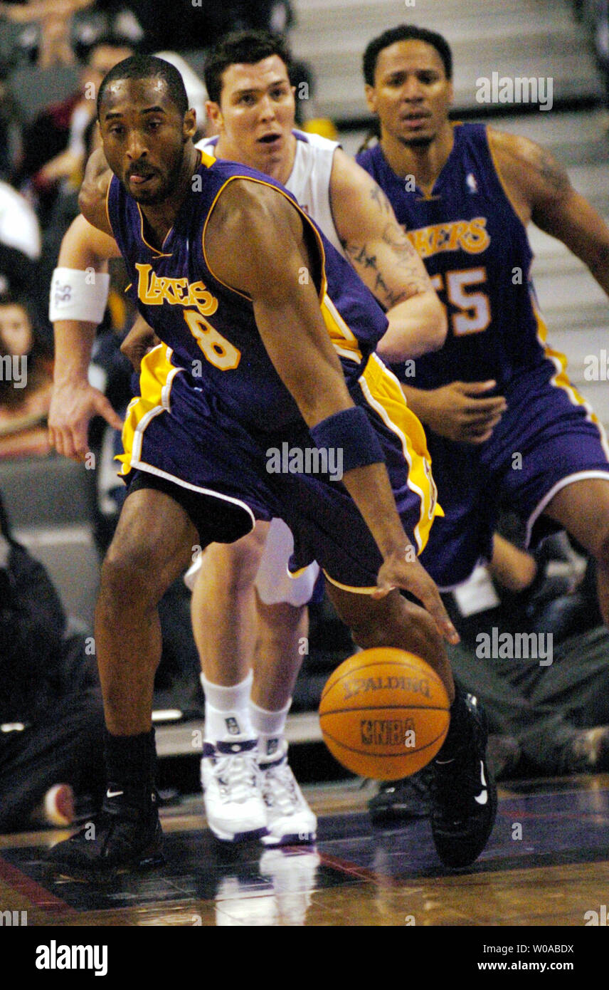 Los Angeles Lakers' Kobe Bryant steals the ball from Toronto Raptors' Rafael Araujo and leads a fast break down the court during first quarter action at the Air Canada Center February 27, 2005 in Toronto, Canada. Bryant led all scorers with 31 points but the Raptors went on to defeat the Lakers 108-102. (UPI Photo/Christine Chew) Stock Photo